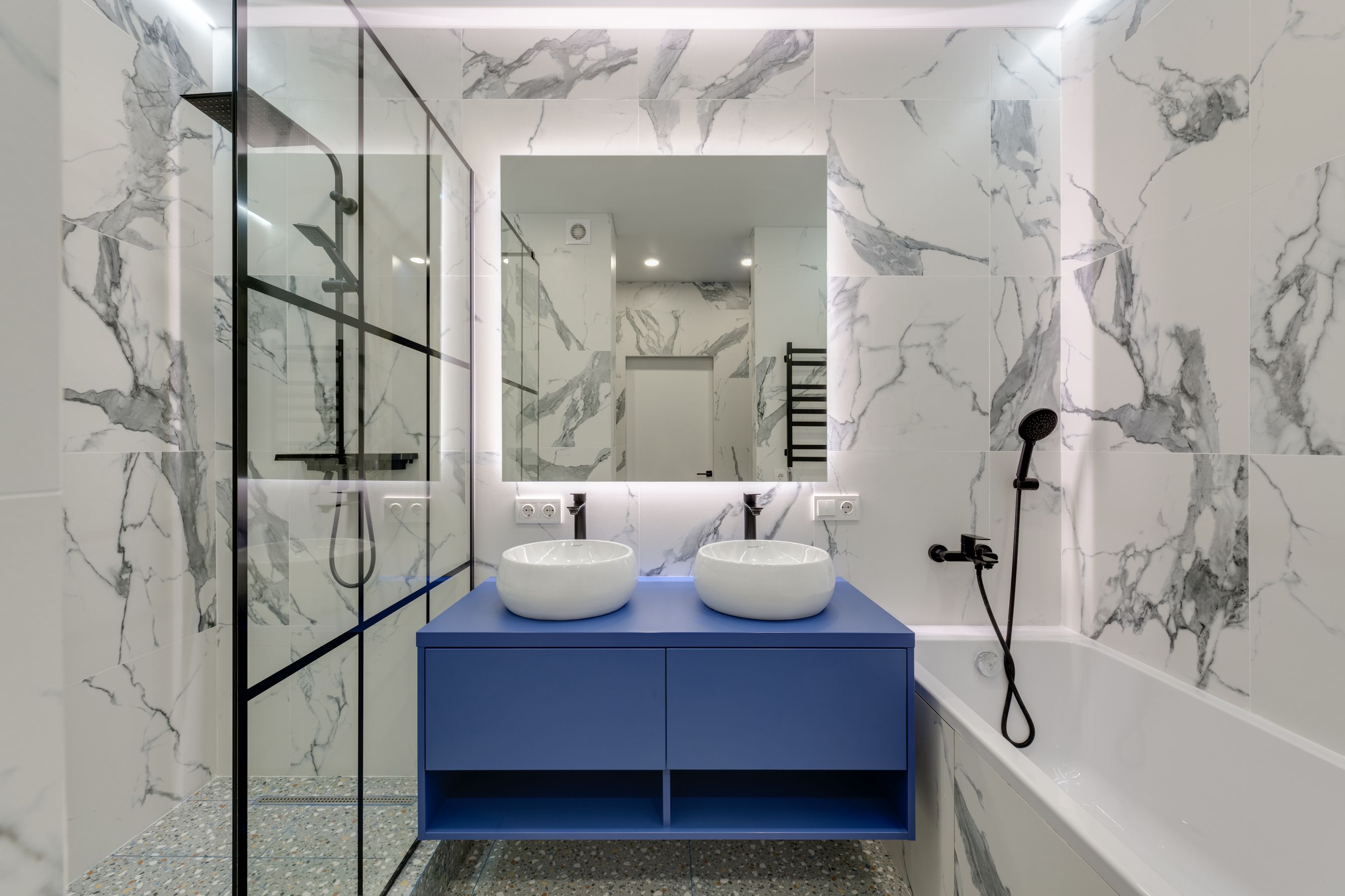 Finished marble bathroom with a double vanity