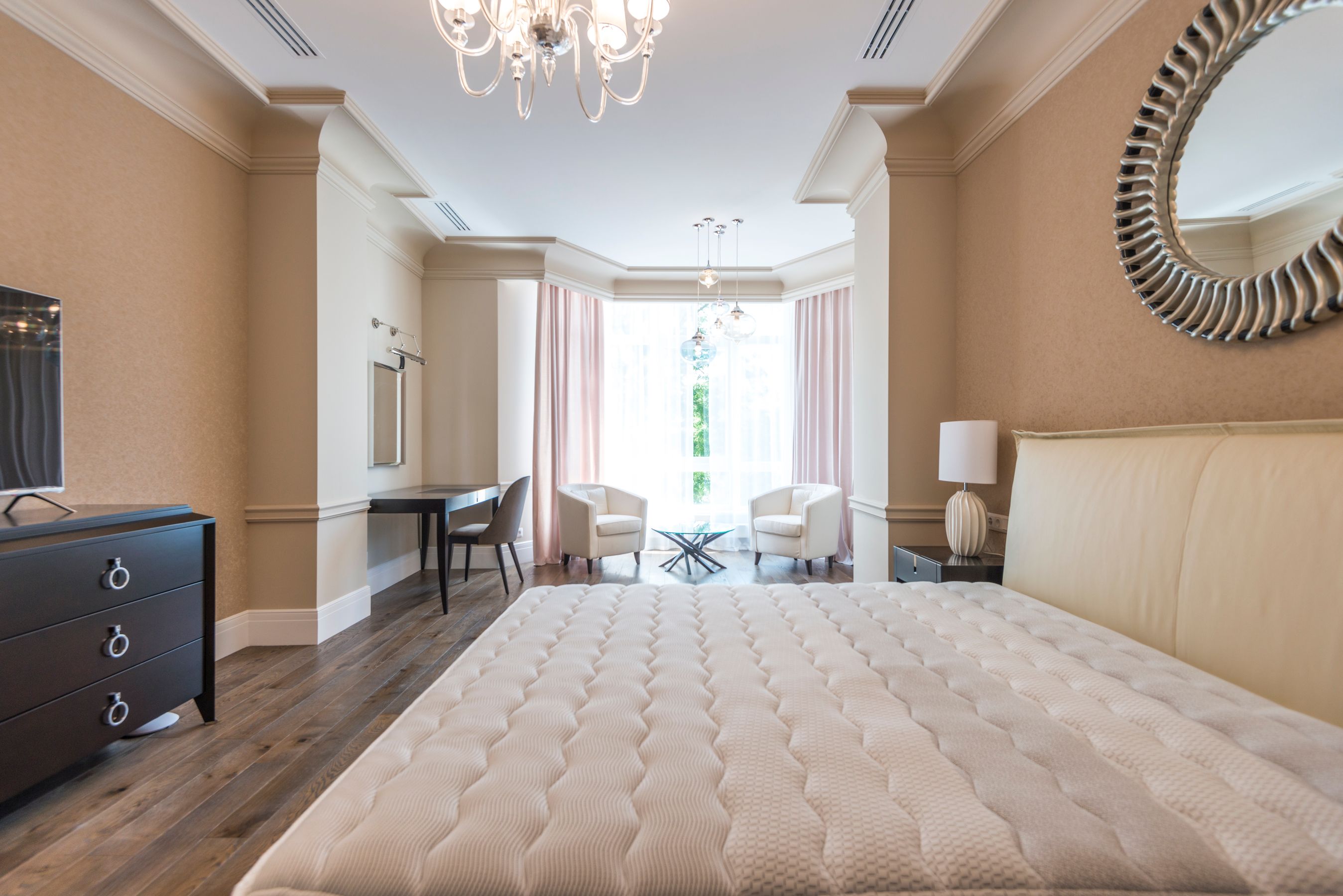 Finished bright main bedroom with large windows
