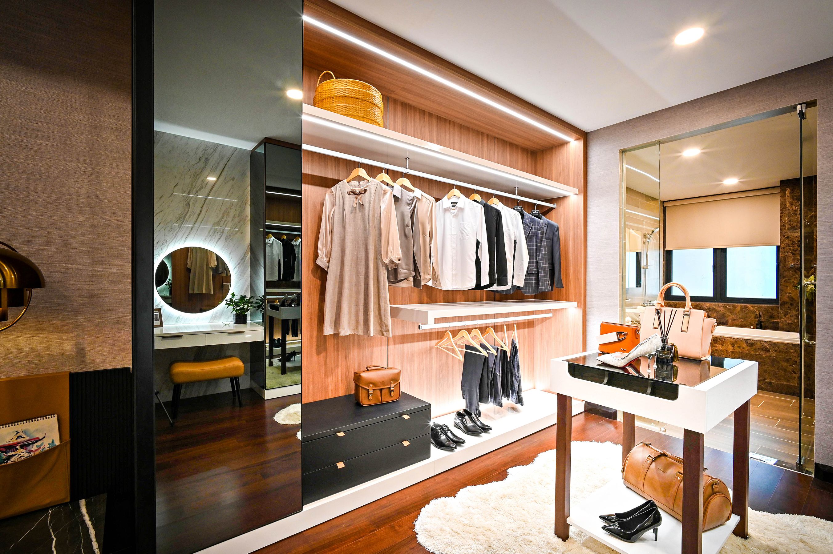 Finished walk-in closet with lit shelving