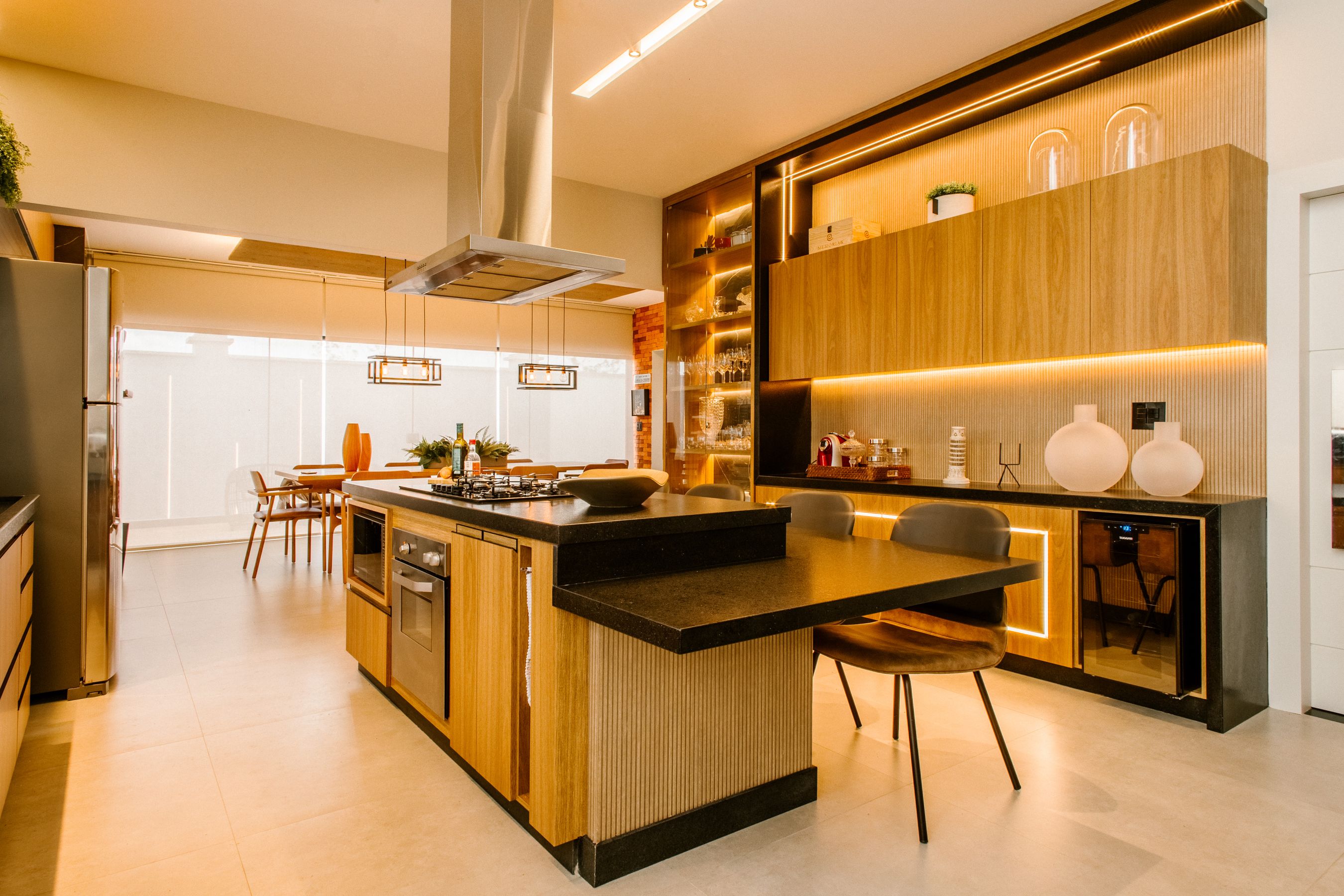 Finished kitchen with warm wood cabinets and under-cabinet lighting