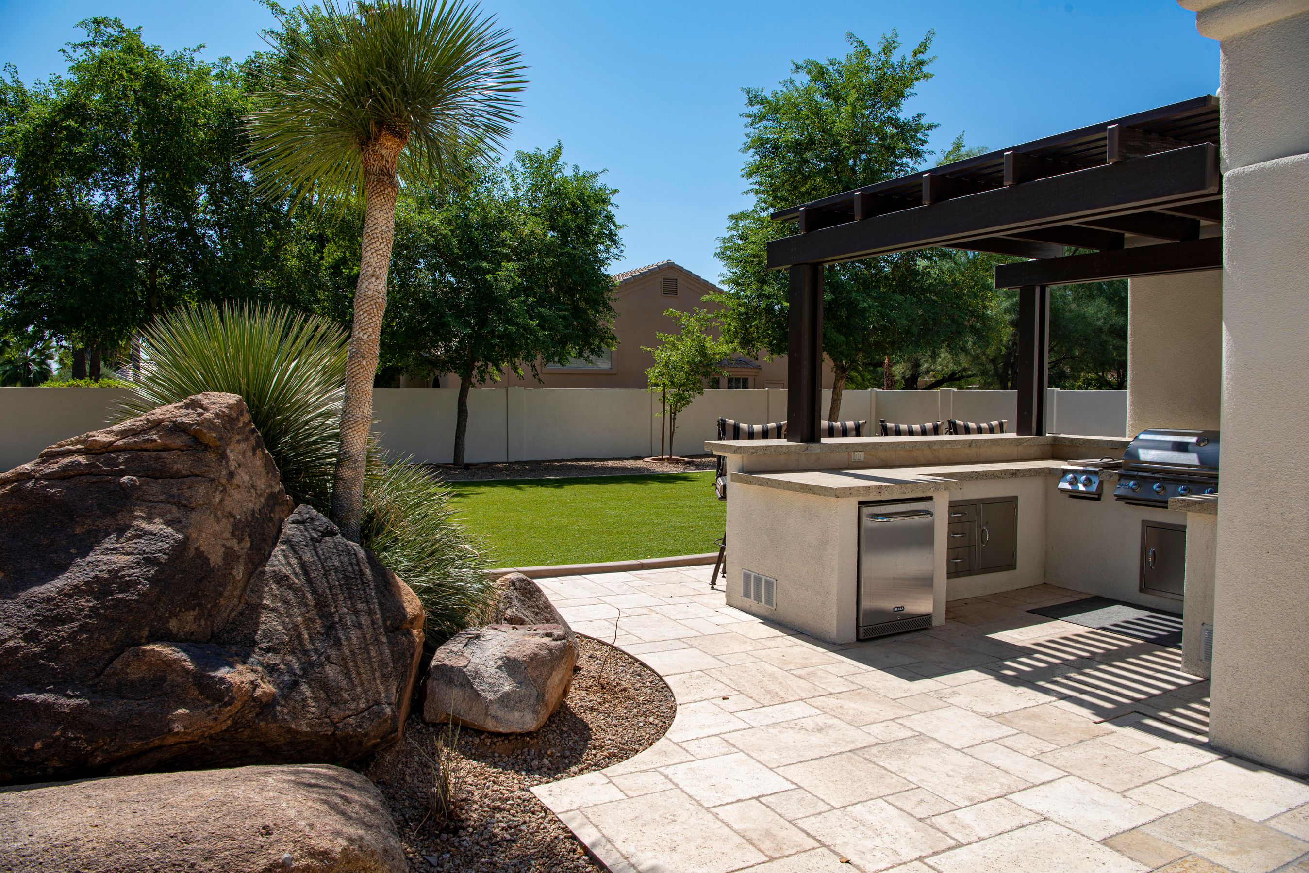 Finished outdoor kitchen and stone patio